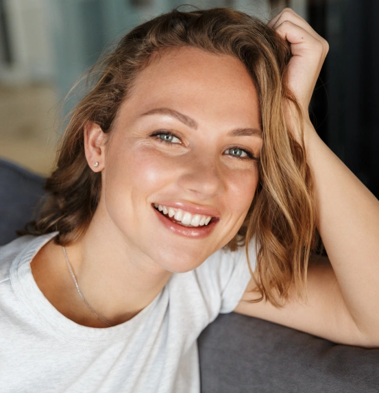 Woman smiling and showing her healthy teeth
