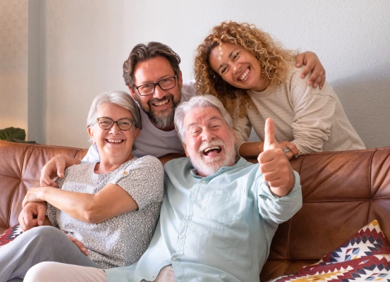 Happy family smiling together on a couch