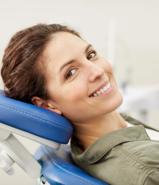 Female patient relaxing comfortably in a dental chair