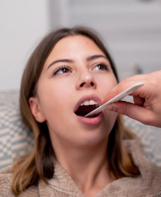 Patient receiving an oral examination before treatment