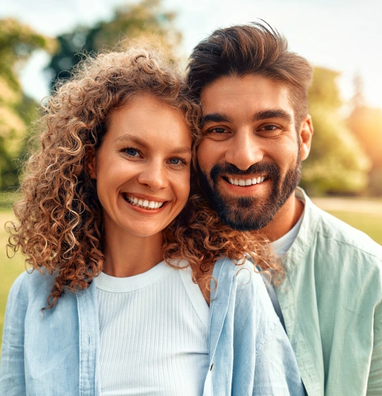 Smiling couple with healthy confident smiles