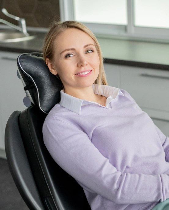 Patient resting comfortably in a dental chair during treatment